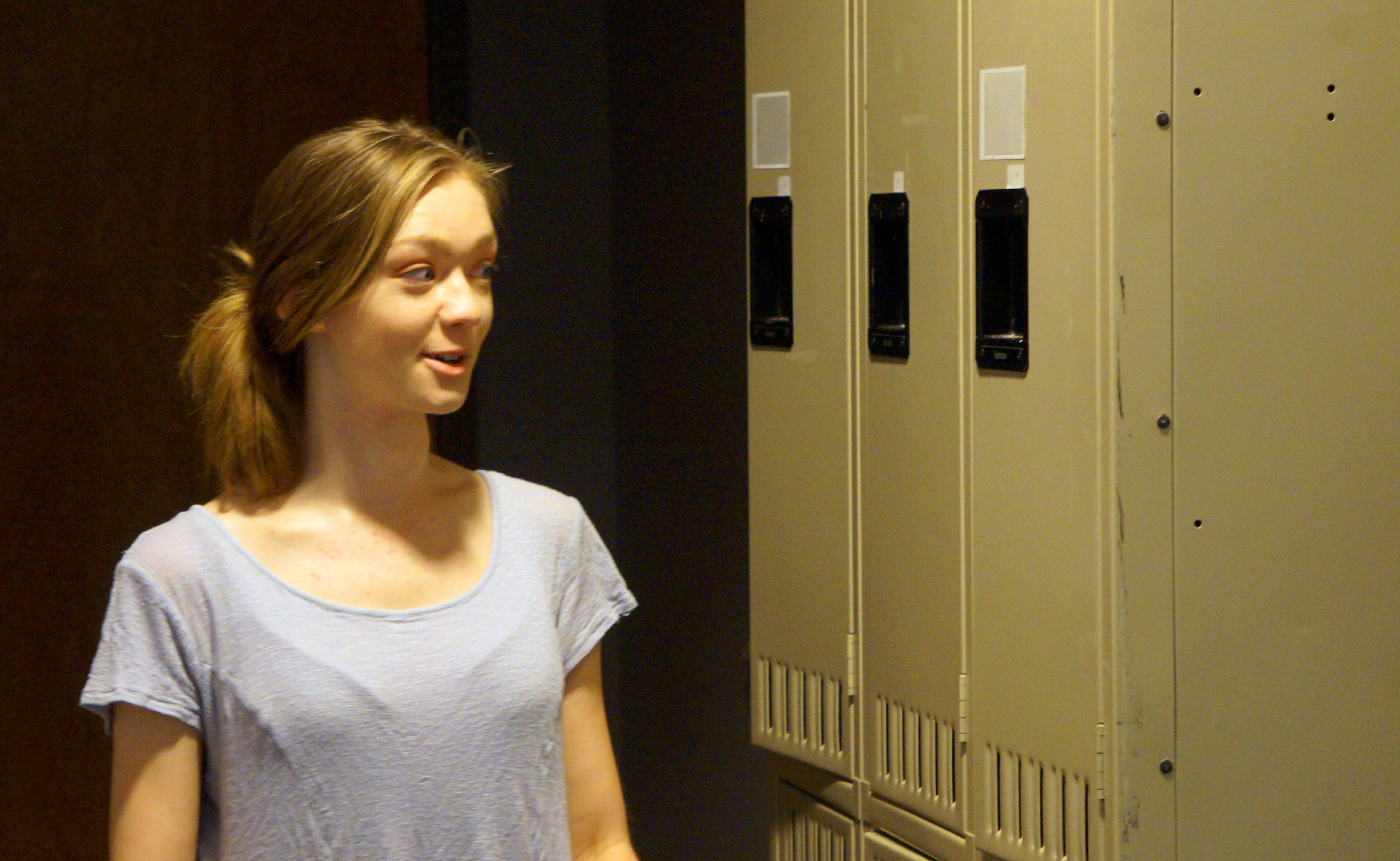 Alexandria Banta proudly gives a tour of the new lockers the Student Advisory Council petitioned for in the Honors Commons.
