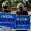 Emily Wilcox and Linda Crenshaw hold signs supporting Jason Hodges for state representative. NICHOLE BARNES | THE ALL STATE