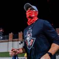 A masked member of the APSU football coaching staff trots onto the field before their game against Central Arkansas. ERIC ELLIOT | APSU SPORTS INFORMATION